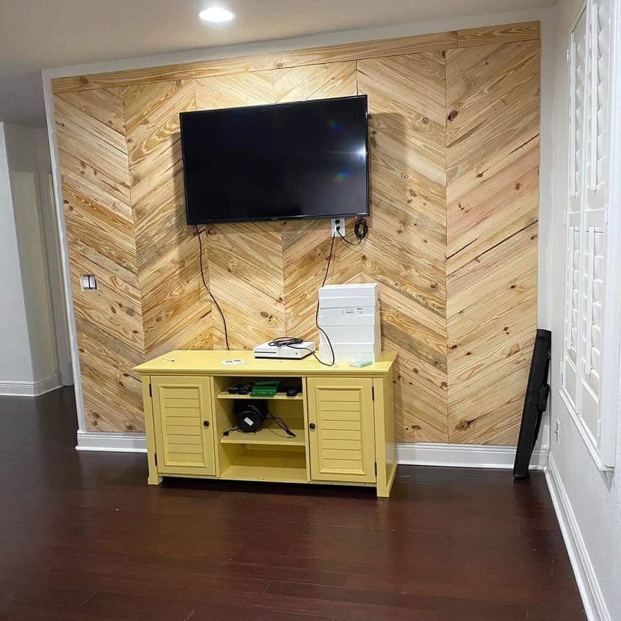 Wood accent walls in living room with tv